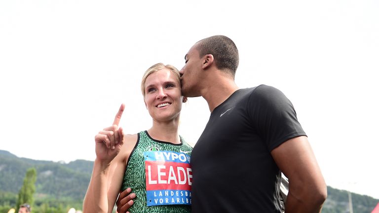 Canada's Brianne Theisen-Eaton receives a kiss from her husband Ashton Eaton after winning the heptathlon event. 