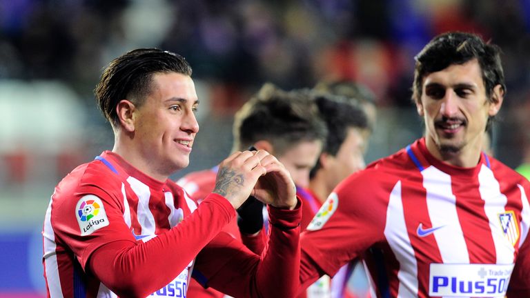 Atletico Madrid's Uruguayan defender Jose Maria Gimenez (L) celebrates after scoring his team's first goal during the Spanish Copa del Rey (King's Cup) qua