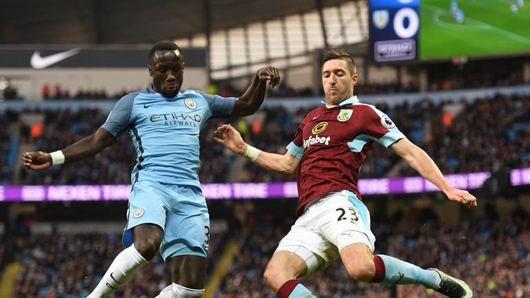 MANCHESTER, ENGLAND - JANUARY 02:  Bacary Sagna of Manchester City (L) and Stephen Ward of Burnley (R) battle for possession during the Premier League matc