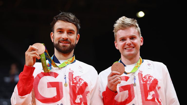 RIO DE JANEIRO, BRAZIL - AUGUST 19:  (L-R) Bronze medalists Chris Langridge and Marcus Ellis of Great Britain stand on the podium during the medal ceremony