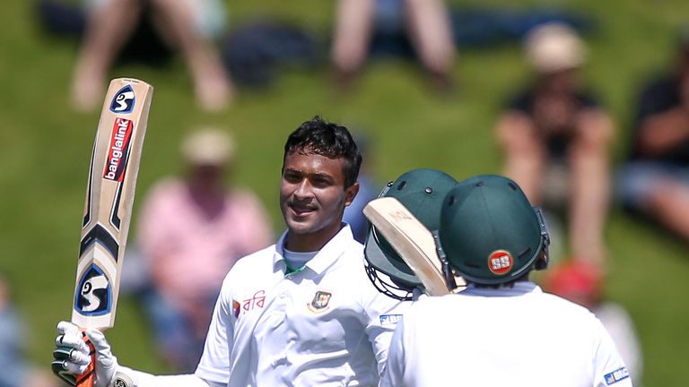 WELLINGTON, NEW ZEALAND - JANUARY 13:  Shakib Al Hasan of Bangladesh celebrates his century with teammate Mushfiqur Rahim during day two of the First Test 
