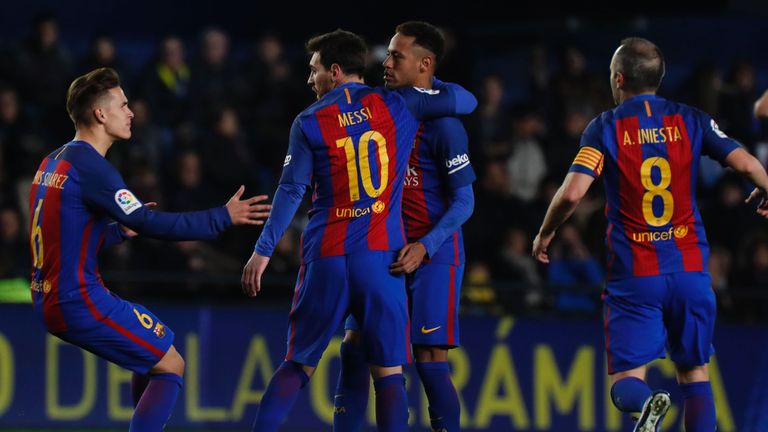 Barcelona's Argentinian forward Lionel Messi (10) celebrates with teammates after scoring during the Spanish league football match Villarreal CF vs FC Barc
