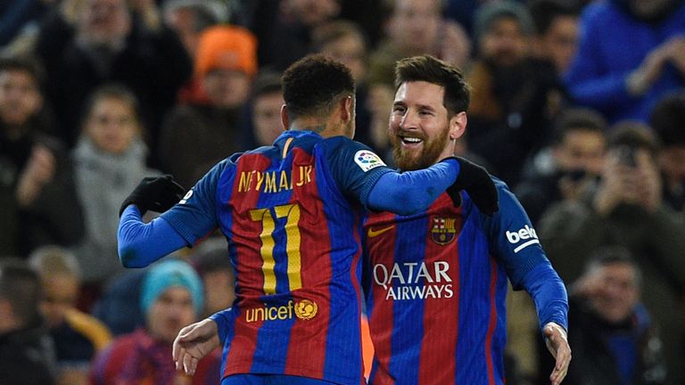 Barcelona's Argentinian forward Lionel Messi celebrates with Barcelona's Brazilian forward Neymar (L) after scoring a goal during the Spanish Copa del Rey 