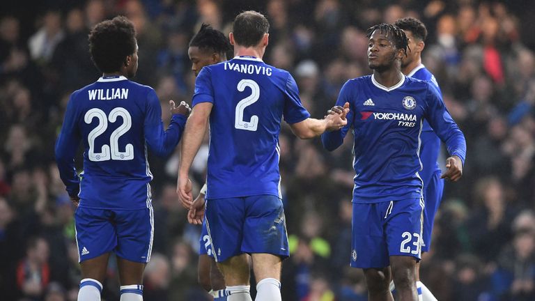 Chelsea's Belgian striker Michy Batshuayi (R) celebrates scoring their second goal during the English FA Cup third round football match between Chelsea and