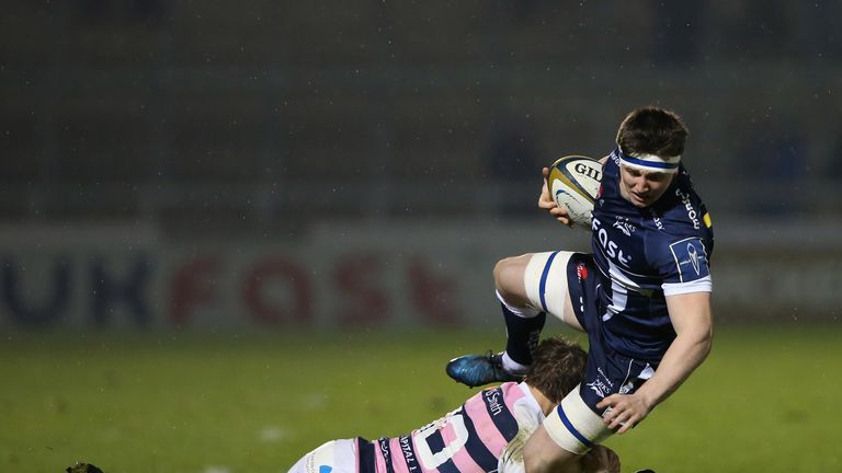 Ben Curry of Sale Sharks is tackled by Jarrod Evans of Cardiff Blues