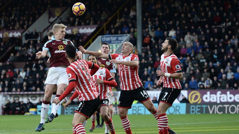 Burnley's English defender Ben Mee (L) misses with this headed attempt during the English Premier League football match between Burnley and Southampton at 