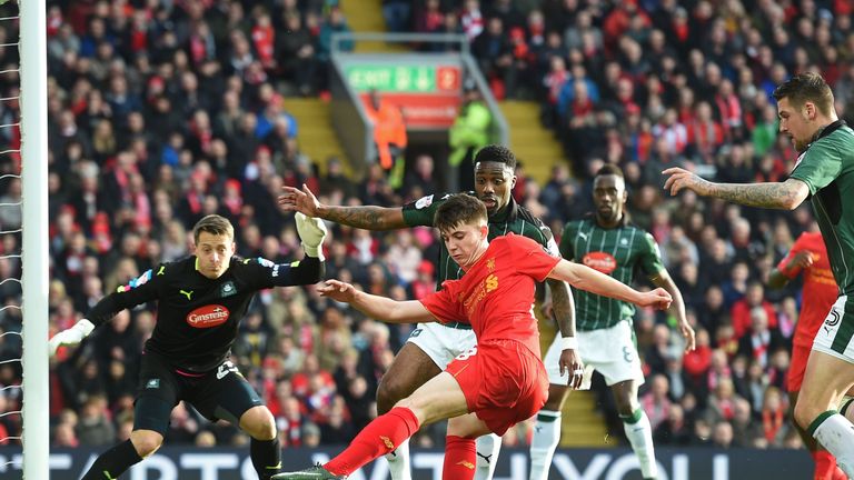 Ben Woodburn (C) has an effort on goal for Liverpool against Plymouth