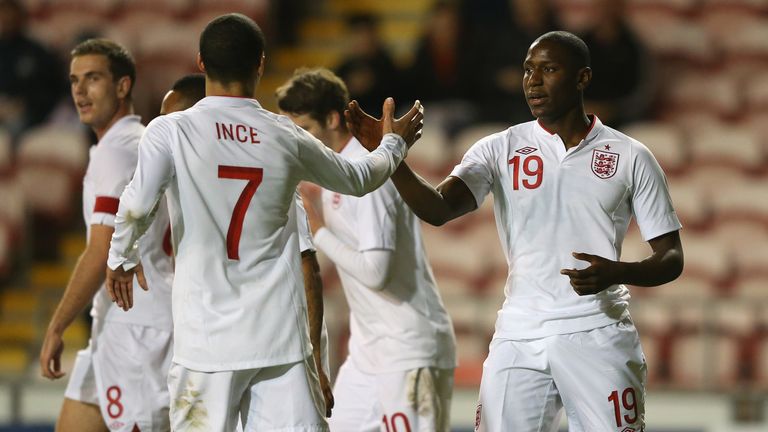 BLACKPOOL, ENGLAND - NOVEMBER 13:  Benik Afobe of England U21 celebrates with Tom Ince after scoring the second goal from the penalty spot during the Inter