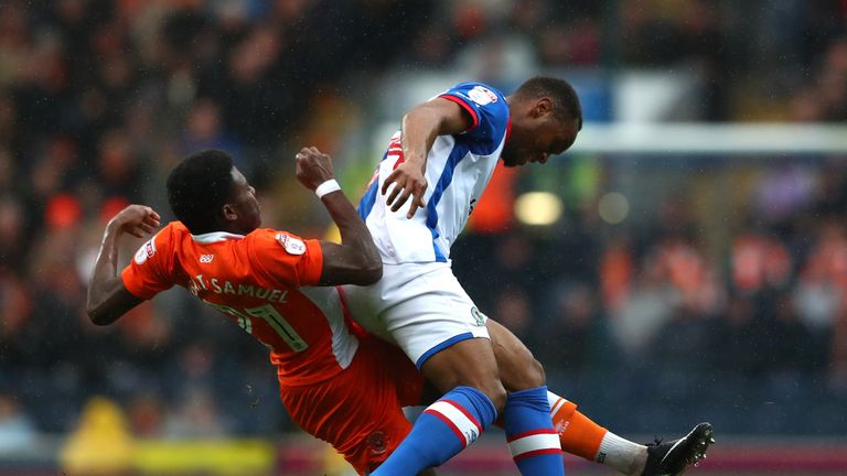 Blackpool's Bright Osayi-Samuel of Blackpool and Ryan Nyambe of Blackburn compete for the ball
