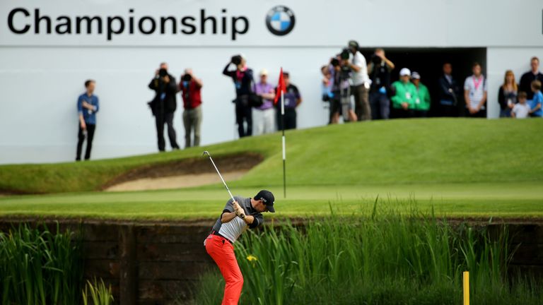 VIRGINIA WATER, ENGLAND - MAY 22:  Rory McIlroy of Northern Ireland hits his approach to the 18th green during day 2 of the BMW PGA Championship at Wentwor