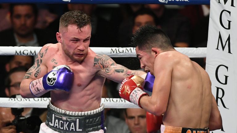 LAS VEGAS, NV - JANUARY 28:  Carl Frampton (L) throws a left at Leo Santa Cruz in the 10th round of their WBA featherweight title fight at MGM Grand Garden