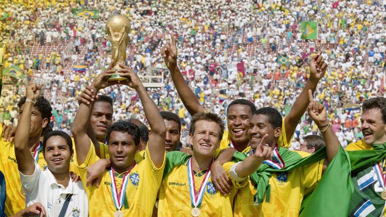 Romario (with trophy) and captain Dunga of Brazil and the Brazilian team celebrate after winning the1994 FIFA World Cup Final against Italy on 17 July 1994