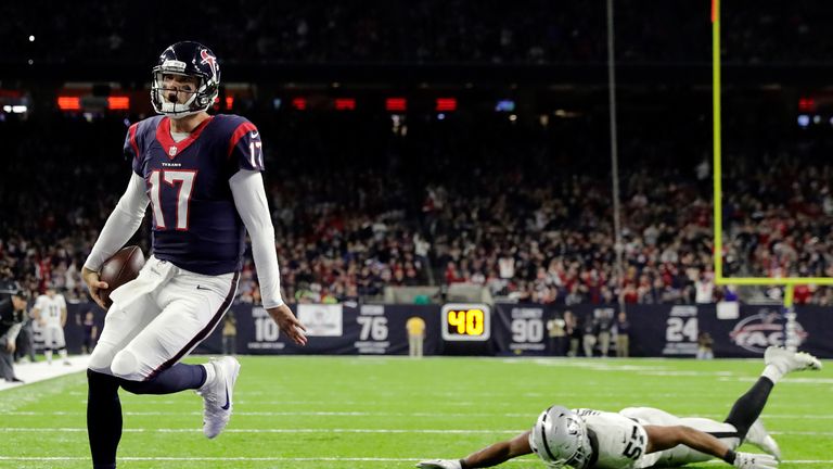 Houston's Brock Osweiler scampers in for a touchdown v Oakland in the NFL wild-card play-offs