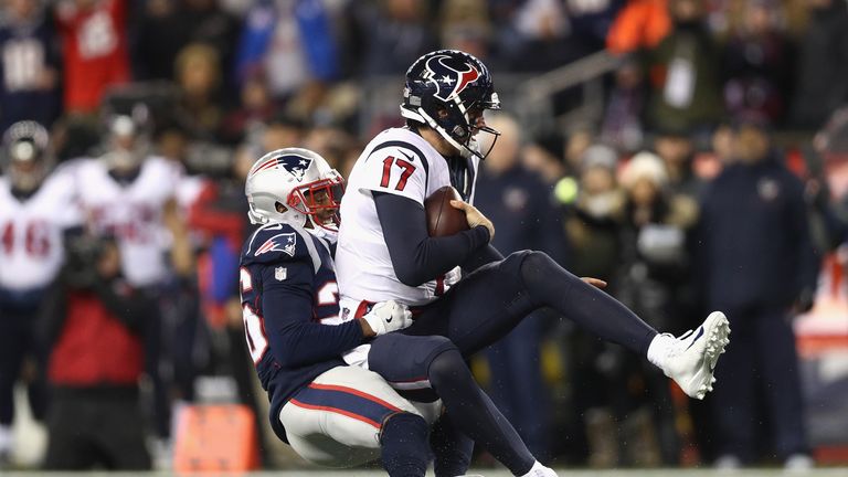 FOXBORO, MA - JANUARY 14:  Logan Ryan #26 of the New England Patriots sacks Brock Osweiler #17 of the Houston Texans in the first half during the AFC Divis