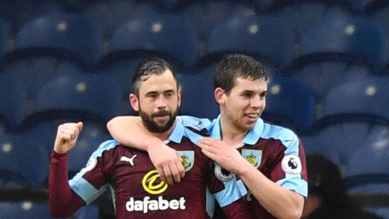 Burnley's Belgian midfielder Steven Defour (L) celebrates scoring their second goal during the English FA Cup fourth round football match between Burnley a