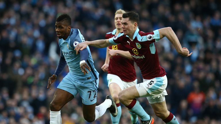 Kelechi Iheanacho of Manchester City is challenged by Burnley's Michael Keane 