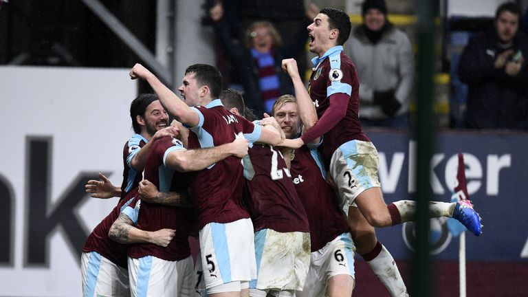 Burnley's Welsh striker Sam Vokes celebrates with teammates after scoring the opening goal of the English Premier League football match between Burnley and