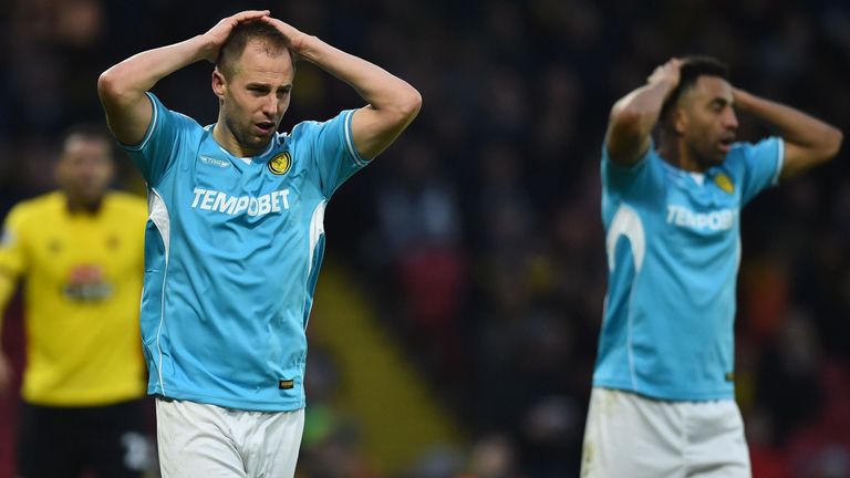 Burton Albion's English striker Luke Varney (L) reacts after missing a chance during the English FA Cup third round football match between Watford and Burt