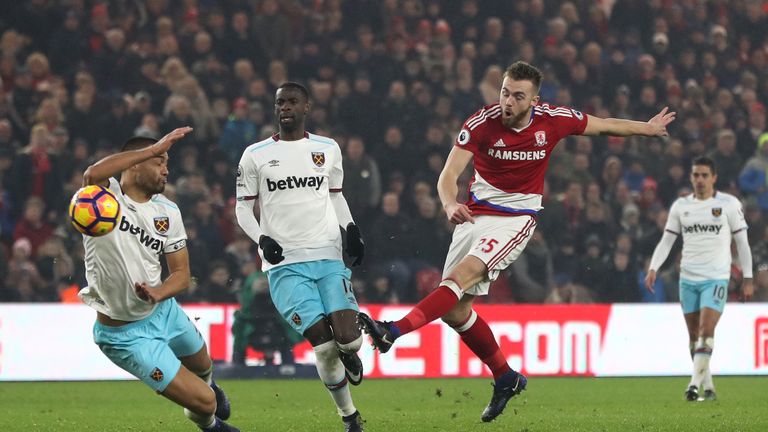 MIDDLESBROUGH, ENGLAND - JANUARY 21: Calum Chambers of Middlesbrough (R) shoots during the Premier League match between Middlesbrough and West Ham United a