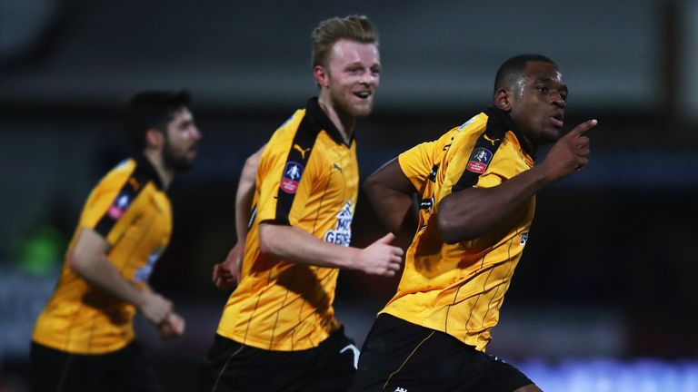 Uche Ikpeazu of Cambridge United (R) celebrates as he scores their first goal during the Emirates FA Cup Third Round match against Leeds
