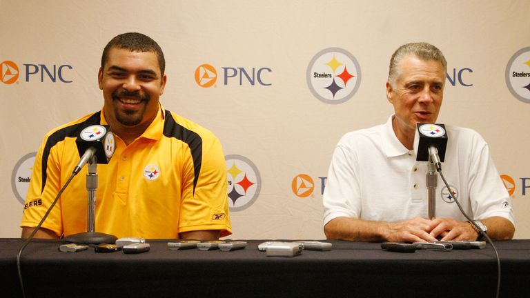LATROBE, PA - JULY 29:  Pittsburgh Steelers first round draft pick Cameron Heyward #95 laughs with President Art Rooney II during a press conference after 