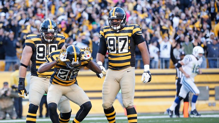 PITTSBURGH, PA - OCTOBER 26:  William Gay #22 of the Pittsburgh Steelers celebrates his interception return for a touchdown with Brett Keisel #99 and Camer