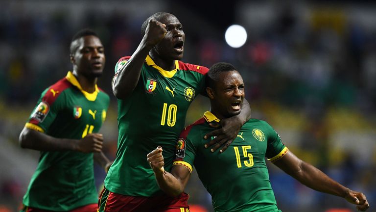 Cameroon's midfielder Sebastien Siani (R) celebrates with Cameroon's forward Vincent Aboubakar after scoring a goal during the 2017 Africa Cup of Nations g