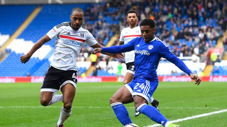 CARDIFF, WALES - JANUARY 08:  Dennis Odoi of Fulham closes down Kadeem Harris of Cardiff City during The Emirates FA Cup Third Round match between Cardiff 