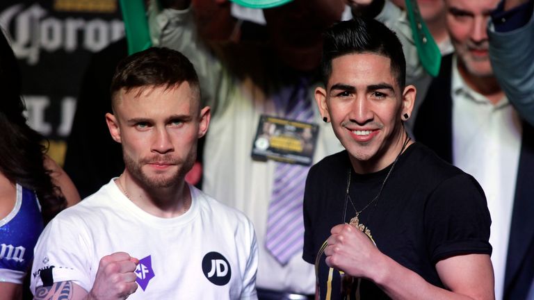 Carl Frampton of Ireland (L) and Leo Santa Cruz of USA pose during their weigh at the MGM Grand Arena in Las Vegas on January 27, 2017. 
The fighters will 