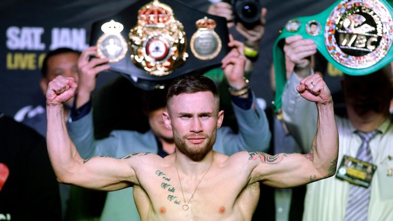 Carl Frampton of Ireland poses on the scales during his weigh in with Leo Santa Cruz of USA at the MGM Grand Arena in Las Vegas on January 27, 2017. 
The f