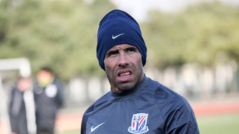 Carlos Tevez takes part in his first training session with new club Shanghai Shenhua