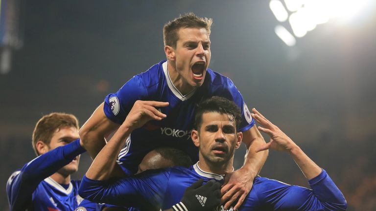 LONDON, ENGLAND - JANUARY 22:  Diego Costa (R) of Chelsea celebrates scoring the opening goal with his team mates during the Premier League match between C