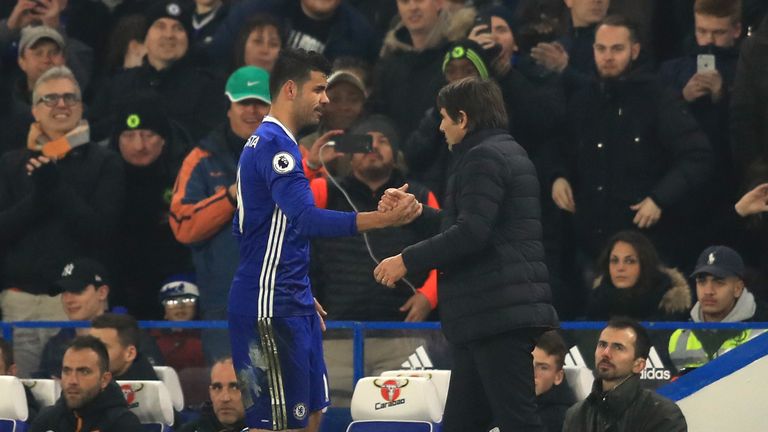 LONDON, ENGLAND - JANUARY 22: Diego Costa of Chelsea shakes hands with Antonio Conte, Manager of Chelsea after substituted during the Premier League match 