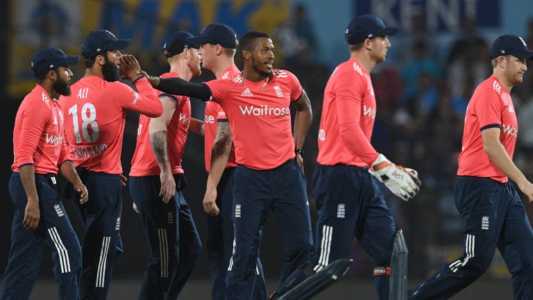 Chris Jordan (C) took 3-22 as England restricted India to 144-8 (Credit: AFP)