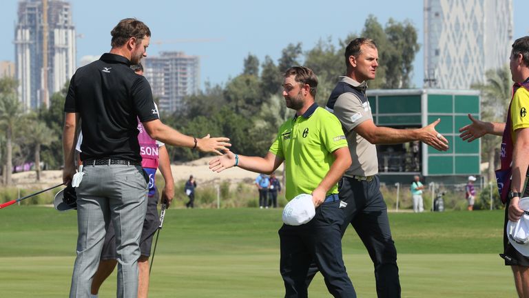 DOHA, QATAR - JANUARY 27:  (L-R) Chris Wood of England,  Andy Sullivan of England and Robert Karlsson of Sweden shake hands on the ninth green   during the
