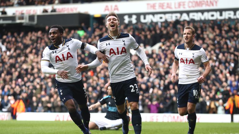 LONDON, ENGLAND - JANUARY 14:  Christian Eriksen of Tottenham Hotspur (C) celebrates his sides second goal after his shot was defelcted in by Gareth McAule