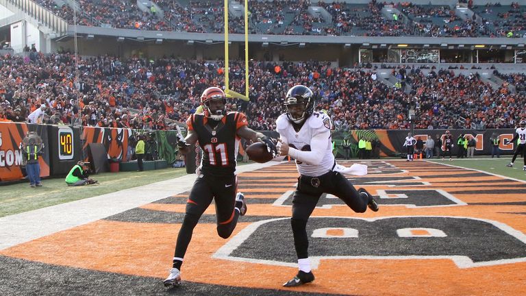 CINCINNATI, OH - JANUARY 1:  Brandon LaFell #11 of the Cincinnati Bengals reaches out to keep Eric Weddle #32 of the Baltimore Ravens from intercepting the