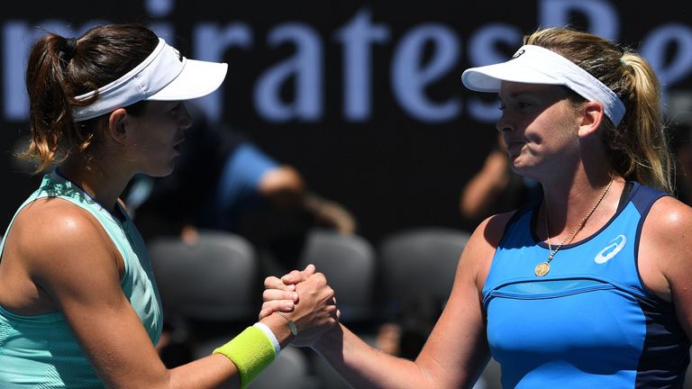 Coco Vandeweghe of the US (R) shakes hands with Spain's Garbine Muguruza during their women's singles quarter-final match on day nine of the Australian Ope