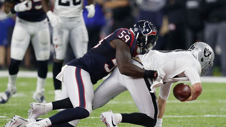 HOUSTON, TX - JANUARY 07:  Whitney Mercilus #59 of the Houston Texans sacks Connor Cook #8 of the Oakland Raiders in their AFC Wild Card game at NRG Stadiu