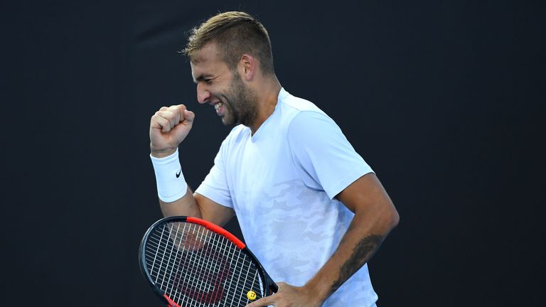 MELBOURNE, AUSTRALIA - JANUARY 18:  Daniel Evans of Great Britain celebrates in his second round match against Marin Cilic of Croatia on day three of the 2