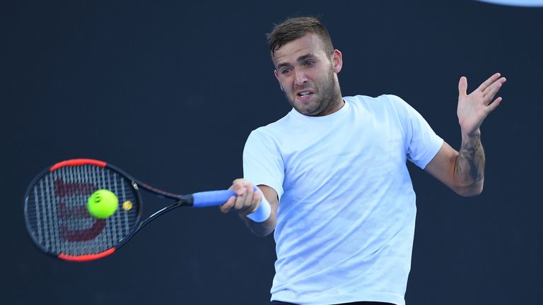 Daniel Evans of Great Britain plays a forehand in his second round match against Marin Cilic of Croatia on day three of the Australian Open