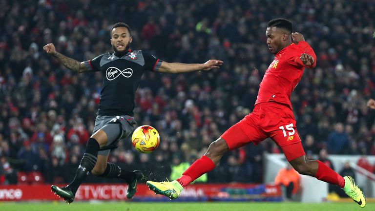 LIVERPOOL, ENGLAND - JANUARY 25: Daniel Sturridge of Liverpool is closed down by Nathan Redmond of Southampton  during the EFL Cup Semi-Final Second Leg ma