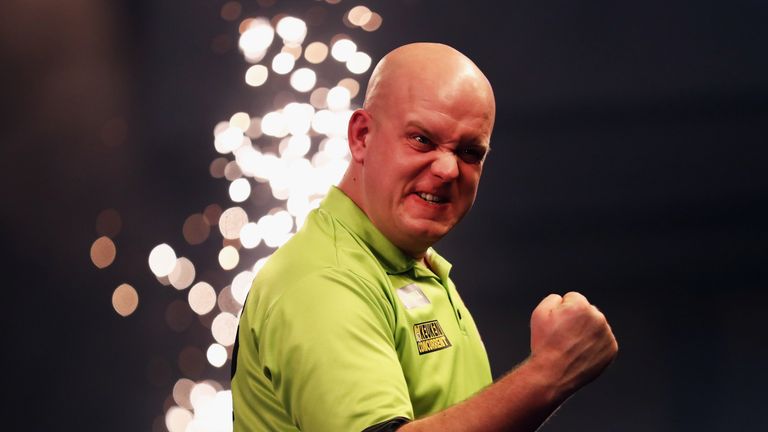 Michael van Gerwen celebrates beating Raymond van Barneveld 