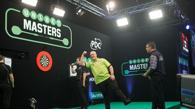 Michael van Gerwen celebrates his victory over Gary Anderson in the 2017 Masters final (Picture: Lawrence Lustig)