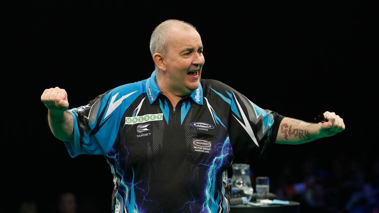 Phil Taylor celebrates during his win over Michael Smith (Picture: Lawrence Lustig)