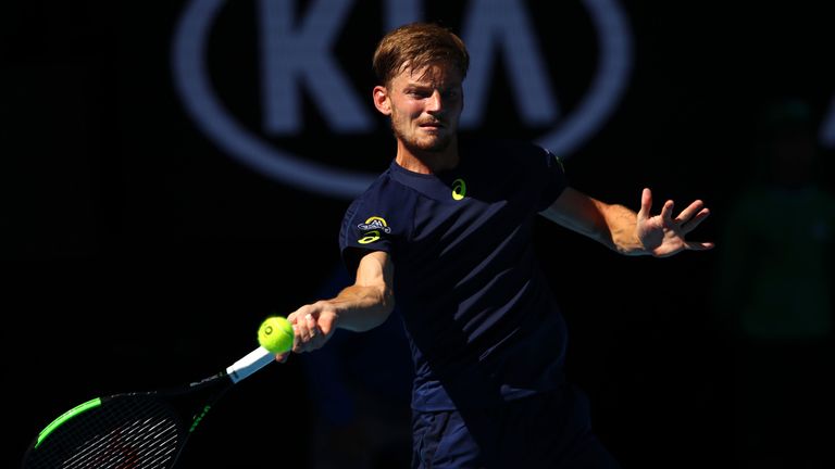 MELBOURNE, AUSTRALIA - JANUARY 25:  David Goffin of Belgium plays a forehand in his quarterfinal match against Grigor Dimitrov of Bulgaria on day 10 of the