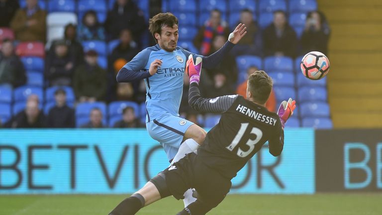 Wayne Hennessey denies David Silva in the opening stages