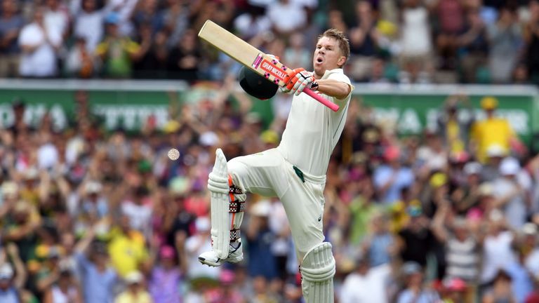 Australia's batsman David Warner celebrates scoring a century (100 runs) against Pakistan during the first day of the third cricket Test match at the SCG i