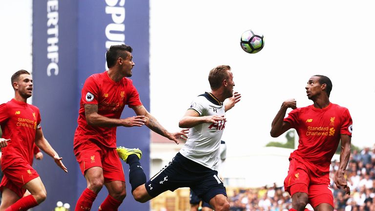 Liverpool defenders Dejan Lovren (L) and Joel Matip challenge Tottenham's Harry Kane