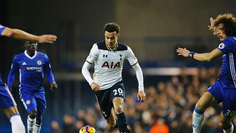Dele Alli looks to take on the Chelsea defence